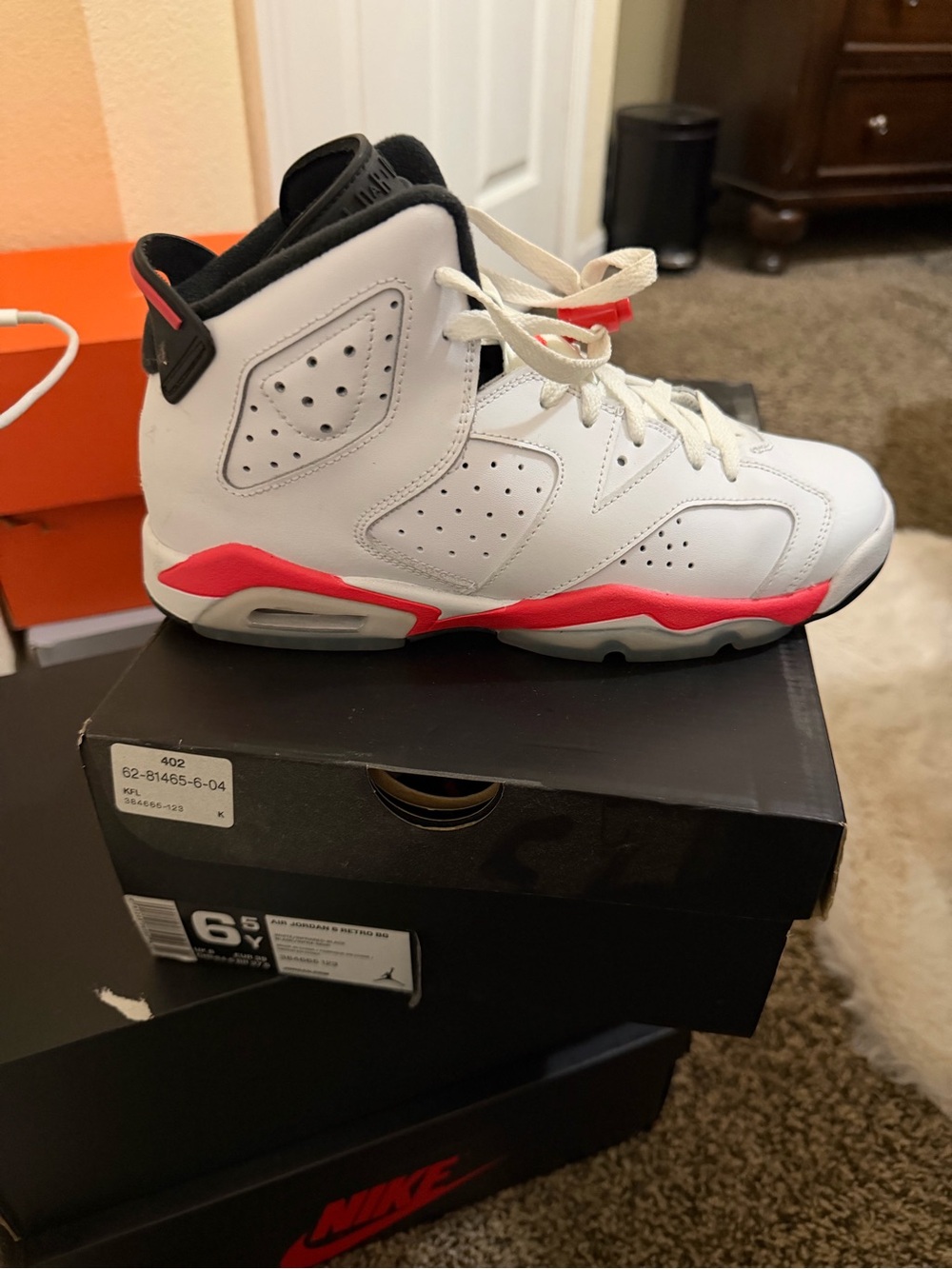 Jordan White and Pink High-Top Sneakers